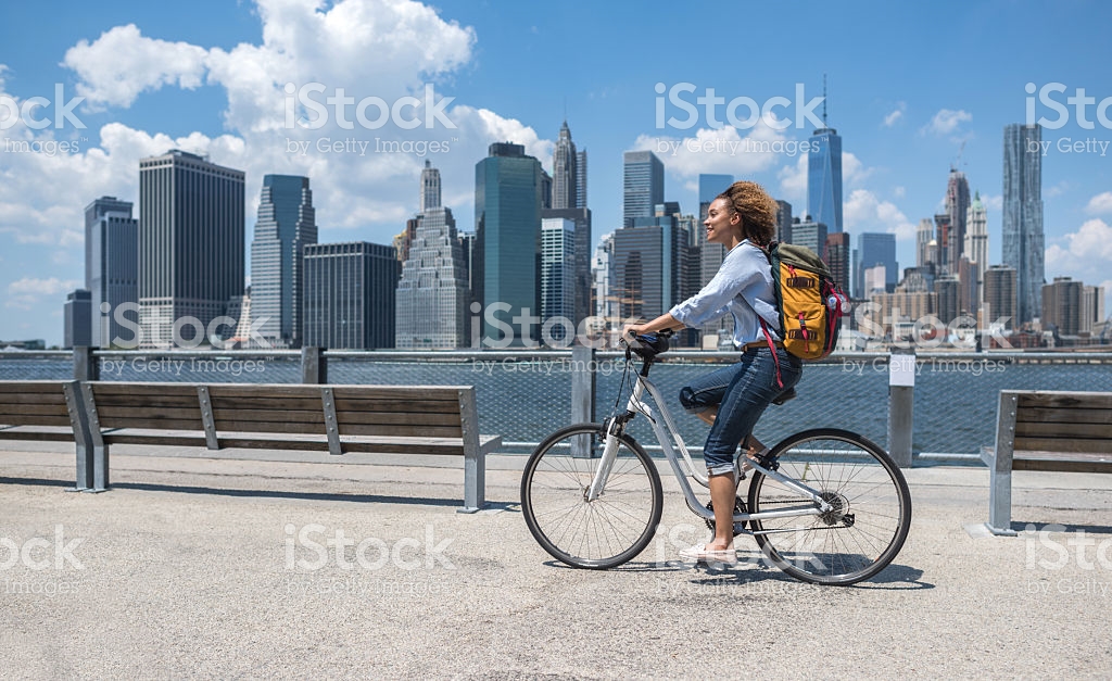 woman biking in city