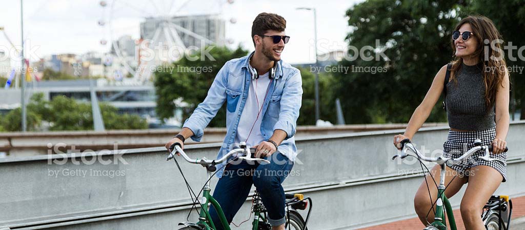 Two people biking