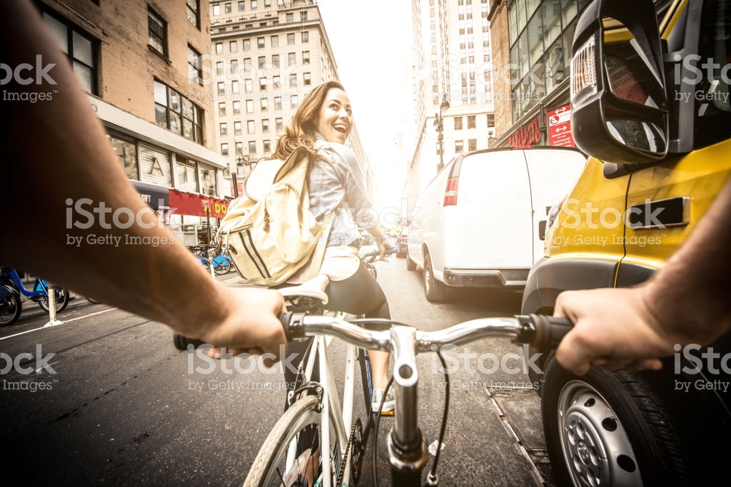 couple biking in NY street