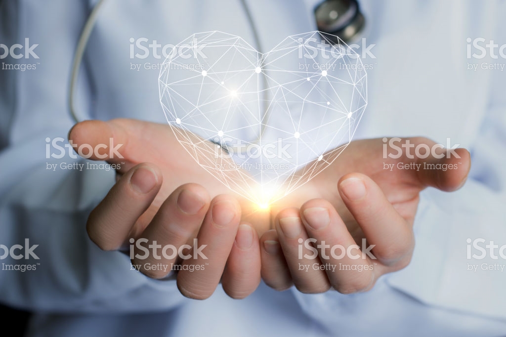 Person with white coat holding a heart illustration