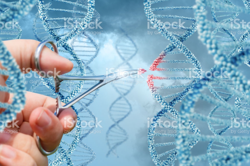 Hand with scissors cutting into dna