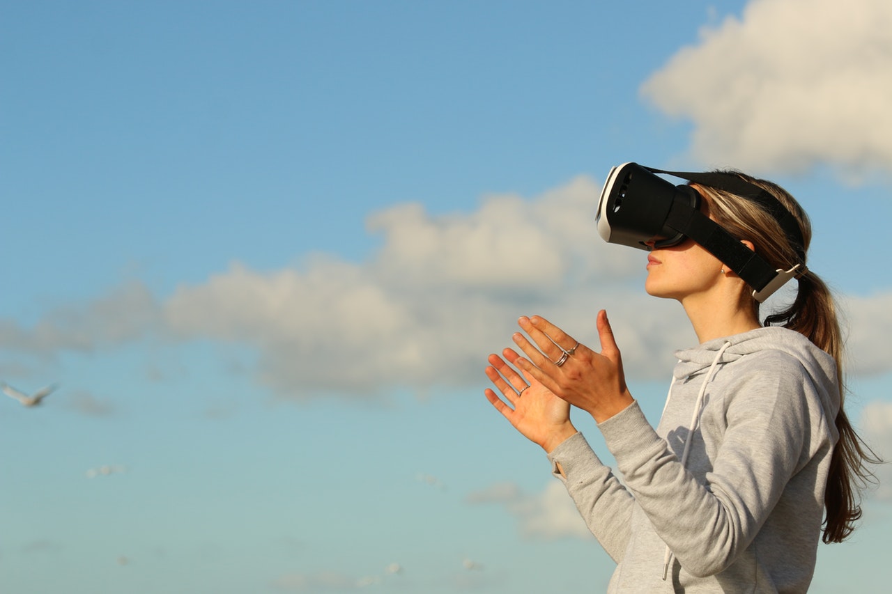 Woman standing outside with VR glasses