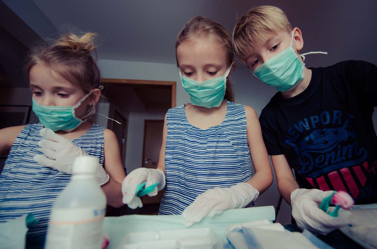 Three kids with facemasks